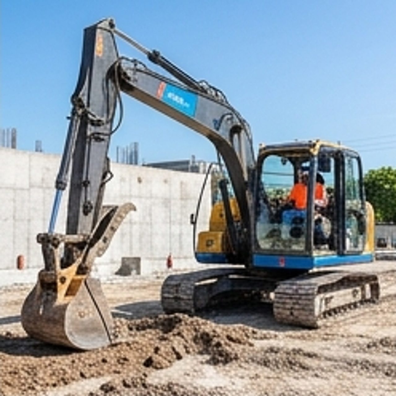 worker operating heavy machinery outdoors