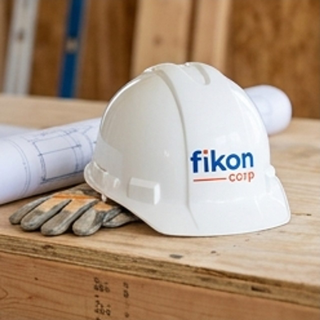 branded hard hat on a workbench